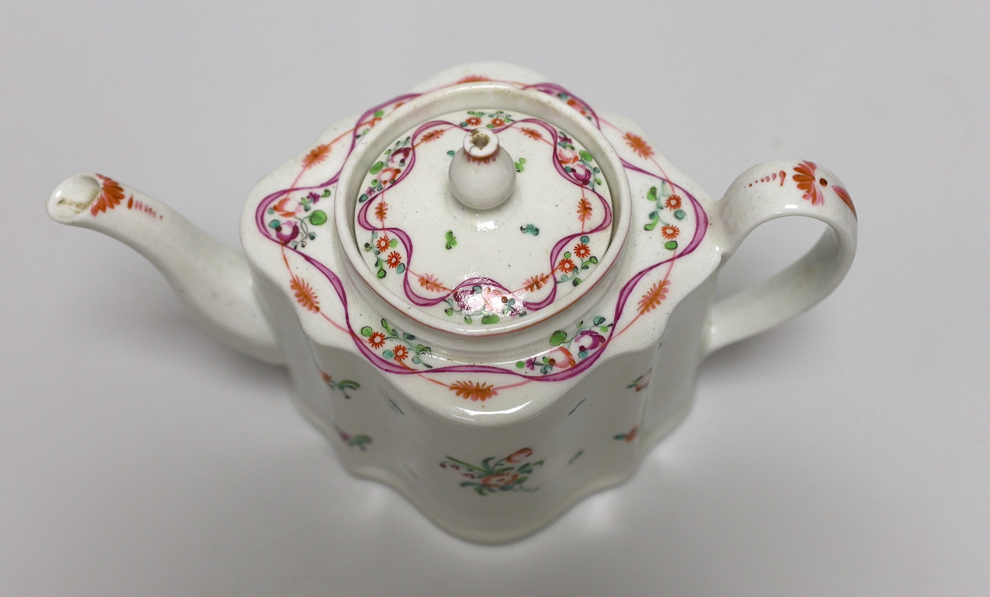 A late 18th century painted Newhall teapot and cover. 14.5cm high